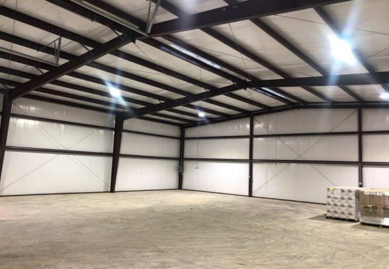 Steel-frame warehouse interior with insulated metal wall panels | United City Construction
